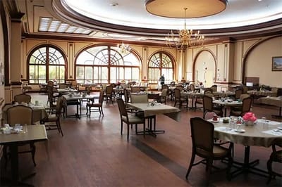 Elegant dining room with tables set for a meal