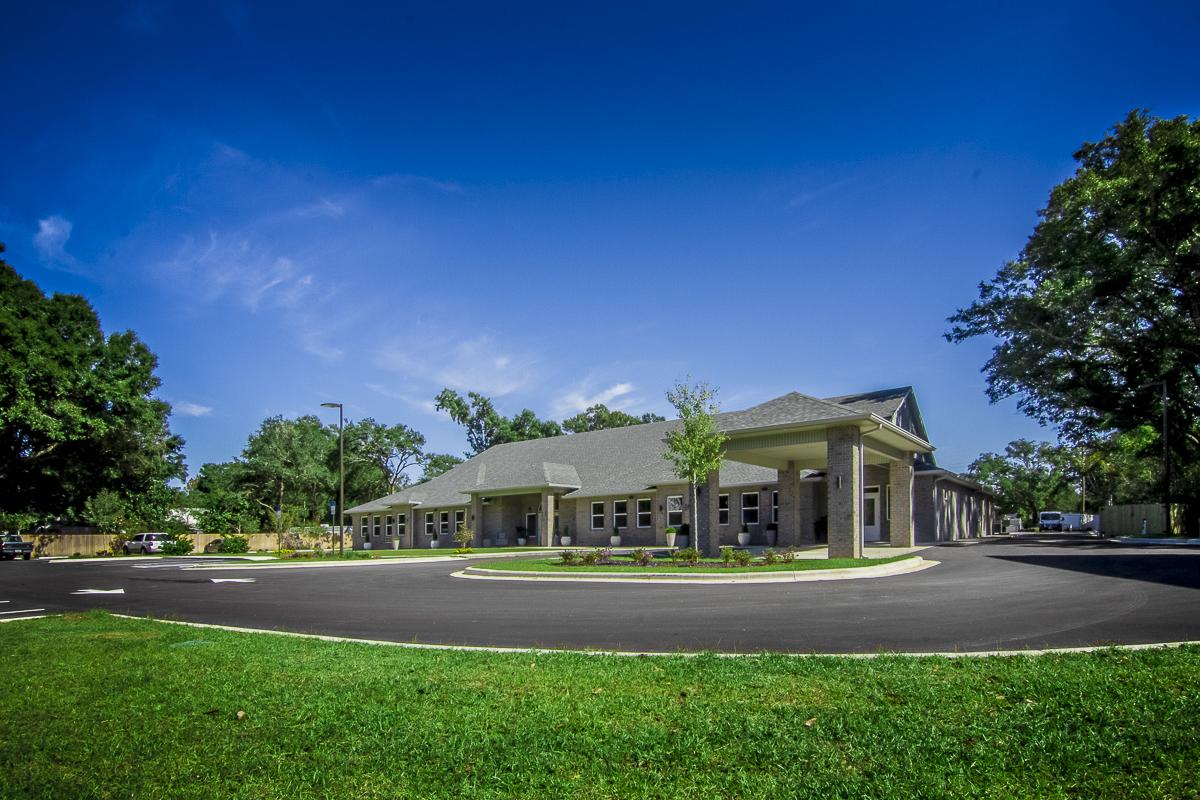 Exterior view of Shelton Manor Inc surrounded by landscaping