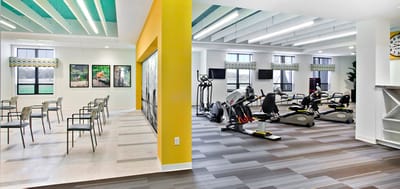 Interior exercise and common area with equipment
