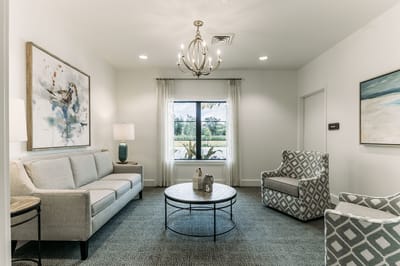 Bright interior common area with seating and artwork