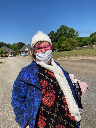 Jonesboro Adult Health & Day Support, Nursing Home — Woman wearing a colorful outfit and a mask outside