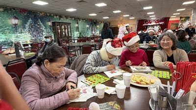 Residents engaged in a holiday activity at a festive common area