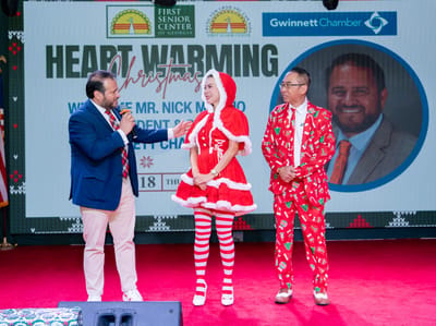 Participants at a Christmas event with festive decorations