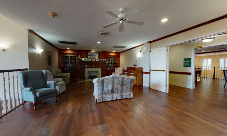Cozy common area with comfortable seating and bookshelves