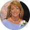 Perfect Care, nursing home in Americus, GA — Woman in a blue dress with a floral corsage