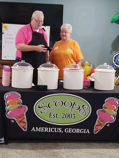 Volunteers serving ice cream at a community event