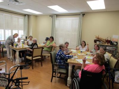 Residents participating in a group activity in the common area