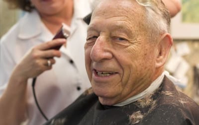 Sarah Adult Day Services, nursing home — Elderly man getting a haircut in a salon