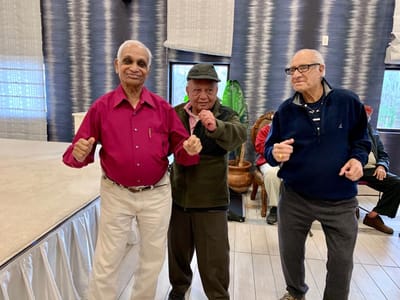 Residents enjoying a lively dance in an activity room