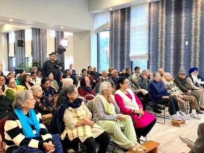 Residents attending an event in a bright common area