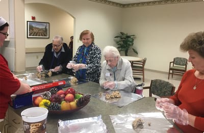 Skylark Adh – Johns Creek, home care in Suwanee, GA — Seniors baking cookies in an activity room