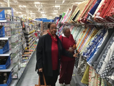 Skylark Adh – Johns Creek, home care in Suwanee, GA — Two women shopping in a fabric store aisle
