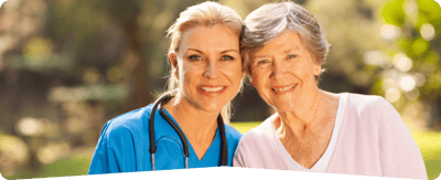 Trinity Care Adult Day Care Center, nursing home — Smiling caregiver with senior woman outdoors