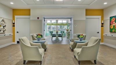 Bright common area with seating and floral decor