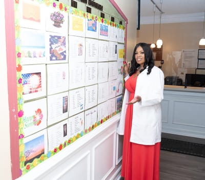 Staff member presenting a community activity board