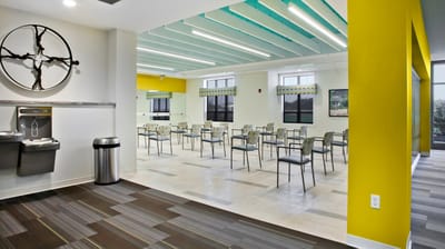 Interior view of a bright common area with chairs