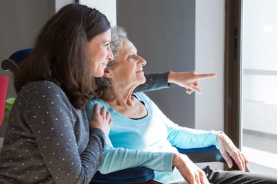 Arbor Terrace at Cascade, memory care in Atlanta, GA — Two women enjoying time together by a window