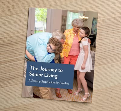 Arbor Terrace at Cascade, memory care in Atlanta, GA — Guidebook titled "The Journey to Senior Living" on a table