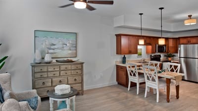 Bright, modern interior of a resident unit with kitchen and living area