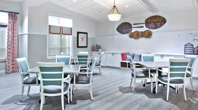 Bright common area with tables and chairs