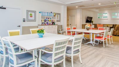 Bright common area with tables and chairs
