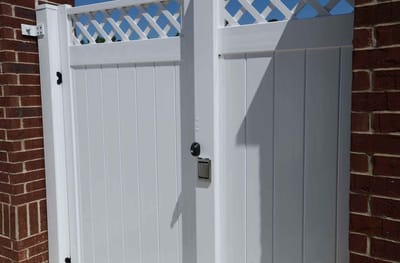 White gate at an outdoor facility entrance