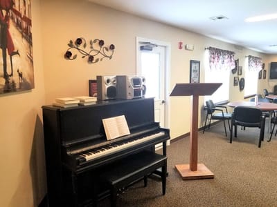 Interior view of a common area with a piano