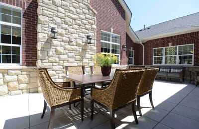 Outdoor patio area with seating and flowers