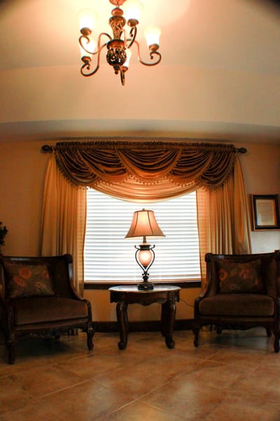 Cozy common area with seating and lamp