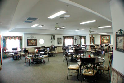 Dining area with tables and chairs for residents
