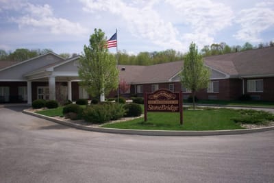Exterior view of the assisted living facility with landscaping