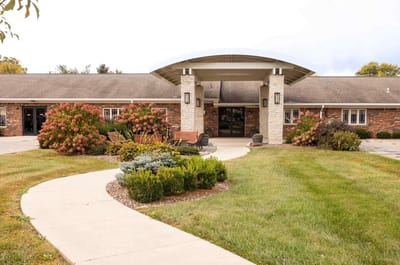 Exterior view of the facility entrance with landscaping