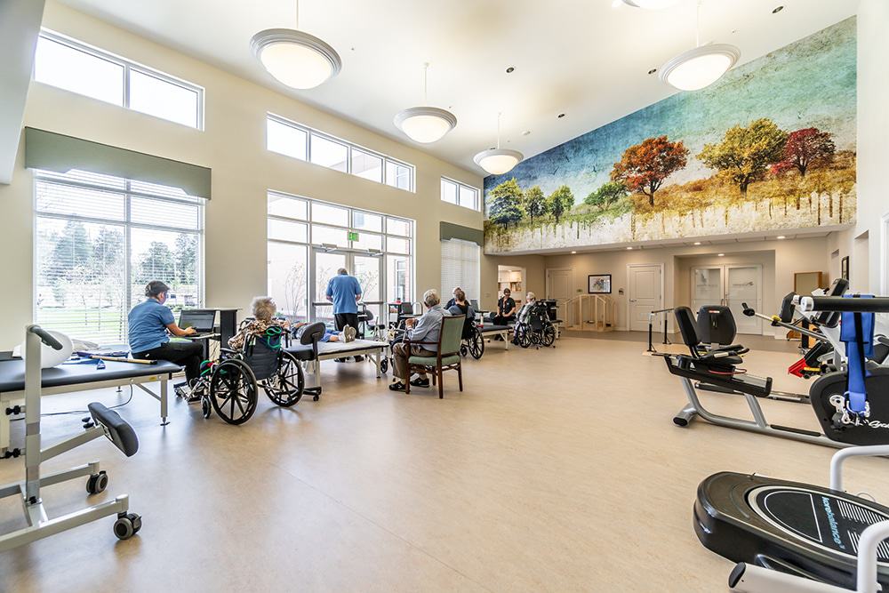 Residents engaging in activities in a large common area