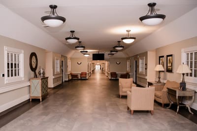 Bright internal corridor with seating areas
