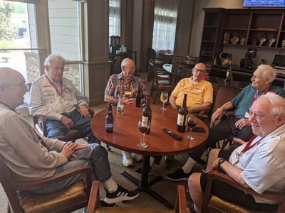 Residents enjoying drinks in a common area