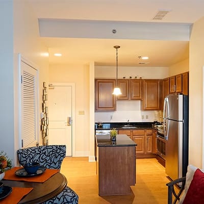 Bright interior view of a kitchenette in a resident suite