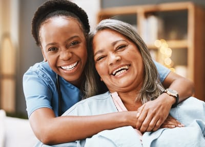 Autumn Lane Health and Rehabilitation, nursing home in Gray, GA — Two women smiling together in a caring environment