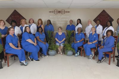 Group photo of staff members in a facility common area