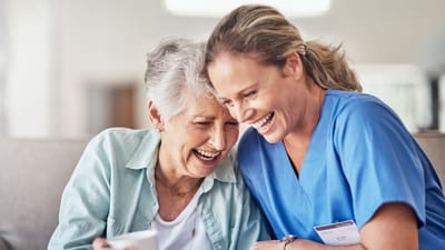 Nurse Care of Buckhead, Nursing Home in Atlanta, GA — Elderly woman enjoying time with a caregiver