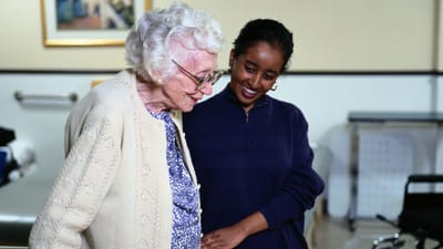 Nurse Care of Buckhead, Nursing Home in Atlanta, GA — Senior caregiver interacting with elderly resident in a facility