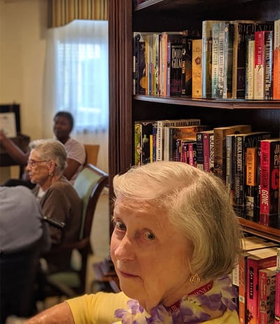 Residents engaged in an activity in the library