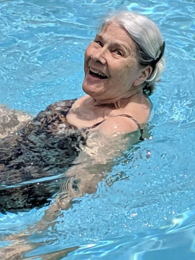Resident enjoying a swim in a pool