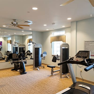 Well-equipped fitness room with exercise machines