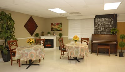 Cozy common area with seating, a fireplace, and decorations