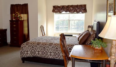 Warm and inviting resident room with window light