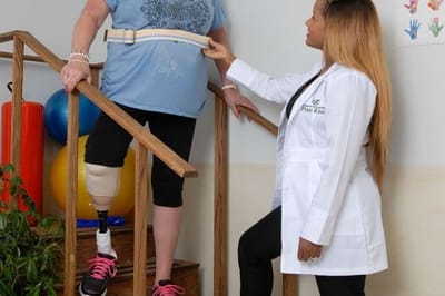 Staff assisting a resident with mobility training
