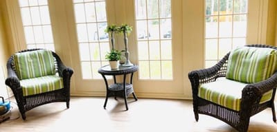 Cozy seating area with green-striped cushions