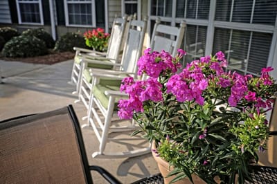 Rocking chairs and flowers on a patio