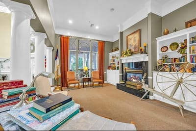 Cozy common area with a fireplace and bookshelves