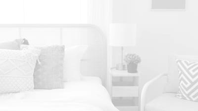 Stylish bedroom with a neutral palette and decorative cushions
